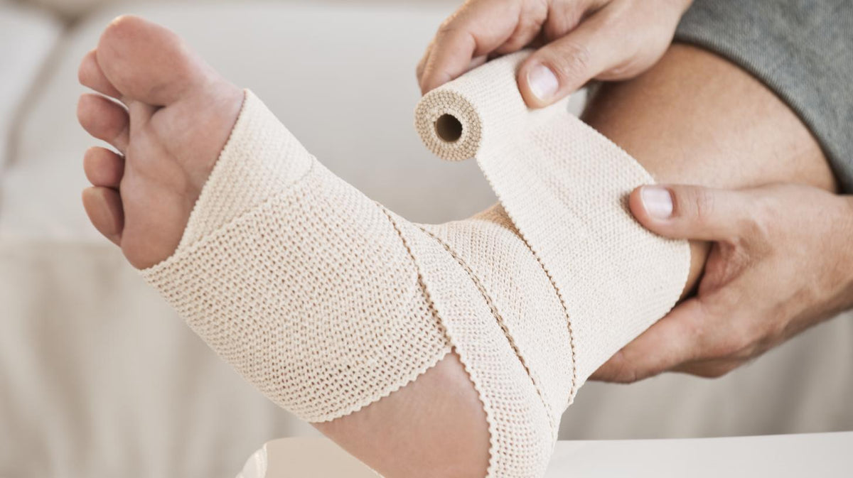How can foot injuries be prevented in the workplace?
